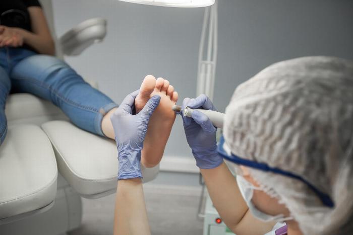 Podiatrist with a patient